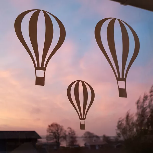 Luftballonger i soluppgång