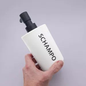 Pumpflaska med texten "Schampo"