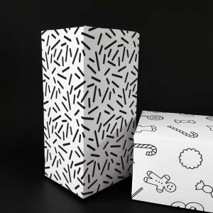 Presentpapper med grafiskt mönster som påminner om gnistor
