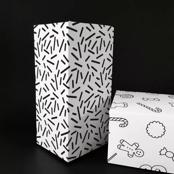 Presentpapper med grafiskt mönster som påminner om gnistor